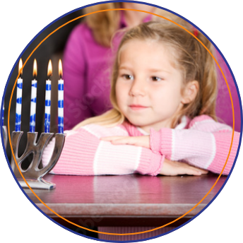 Child looking at a menorah
